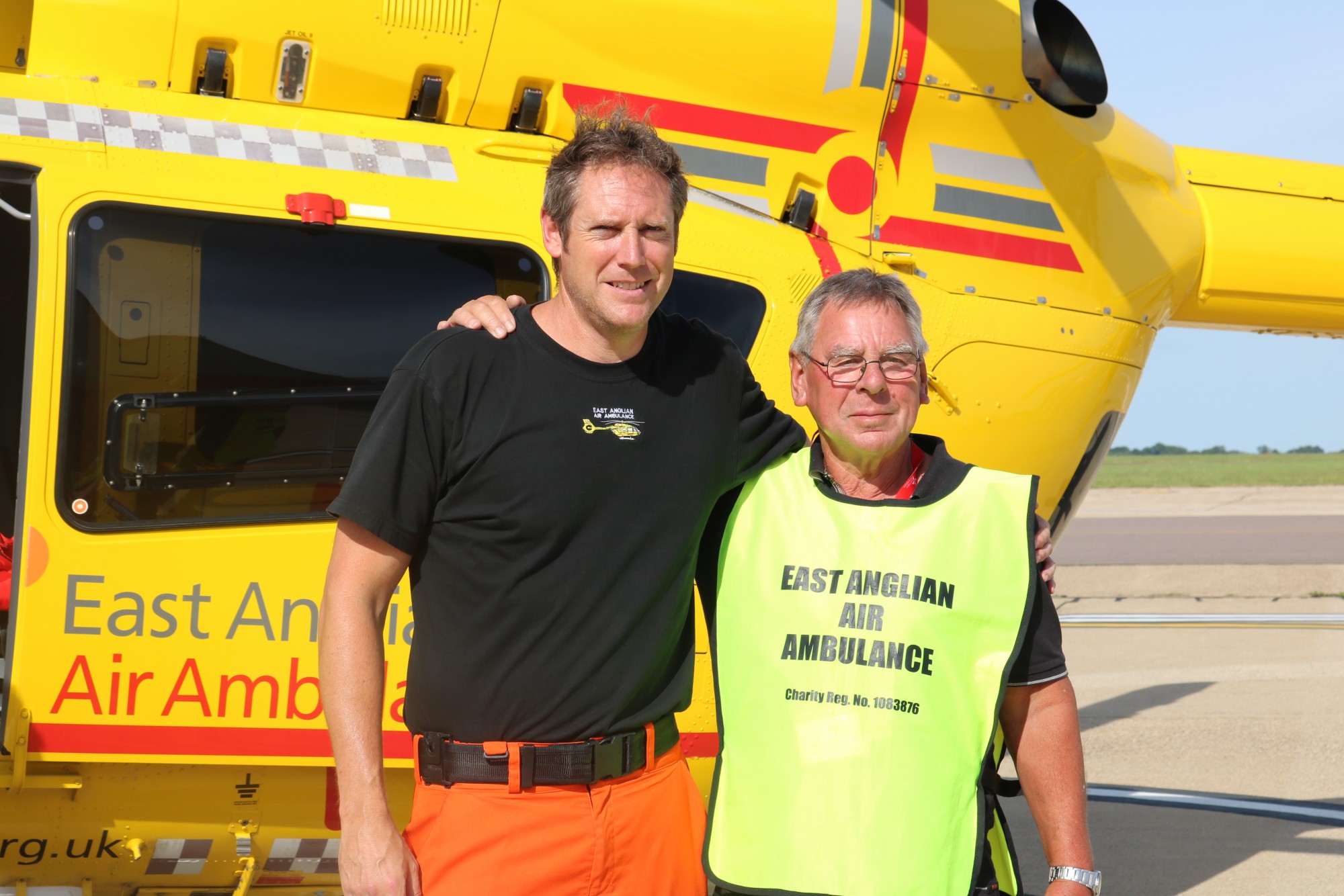 Bob Burford with Critical Care Paramedic Neil Flowers in front of the EAAA helicopter.