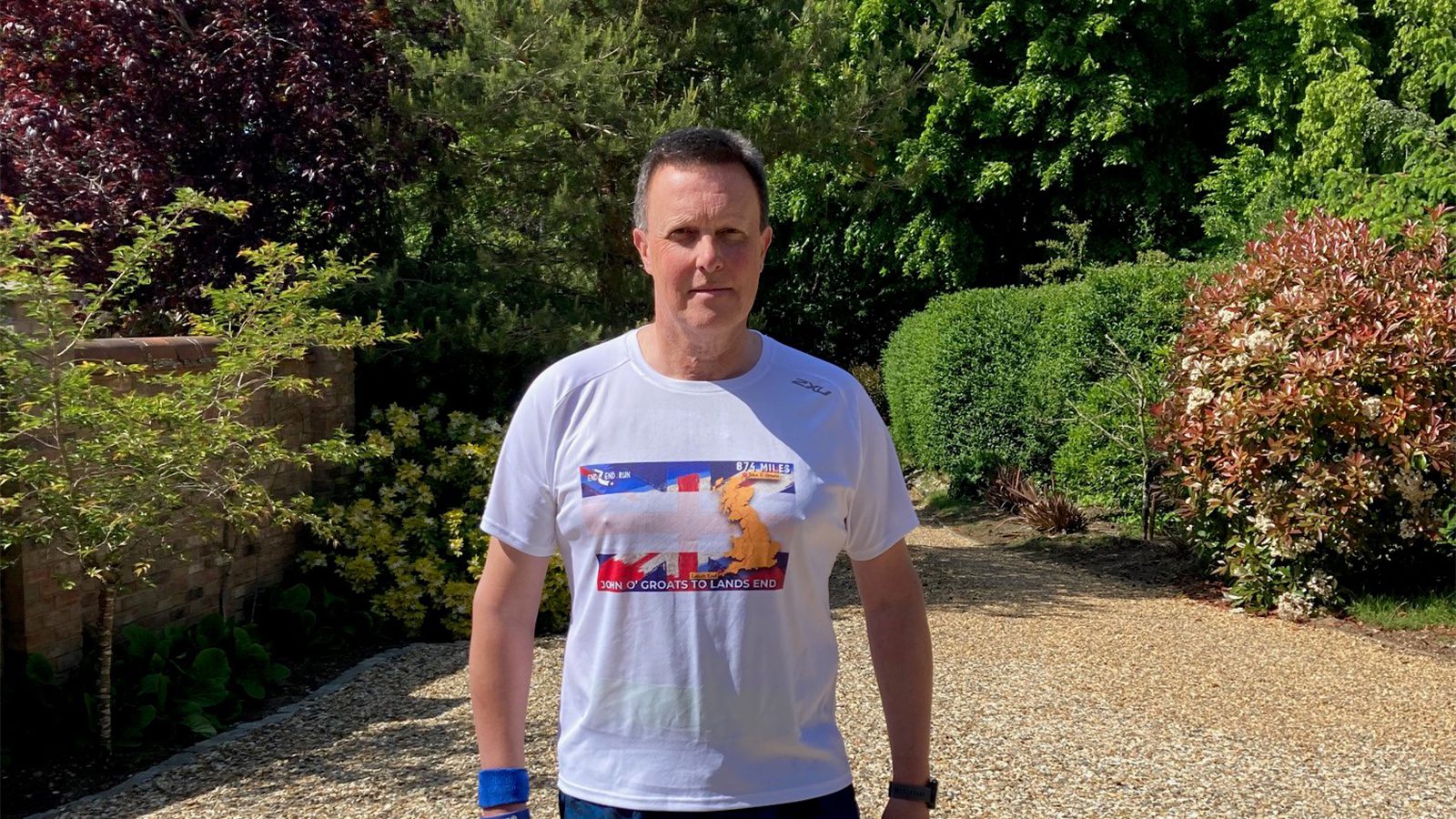 Dan Gilkes pictured wearing his John O'Groats to Land's End t-shirt.