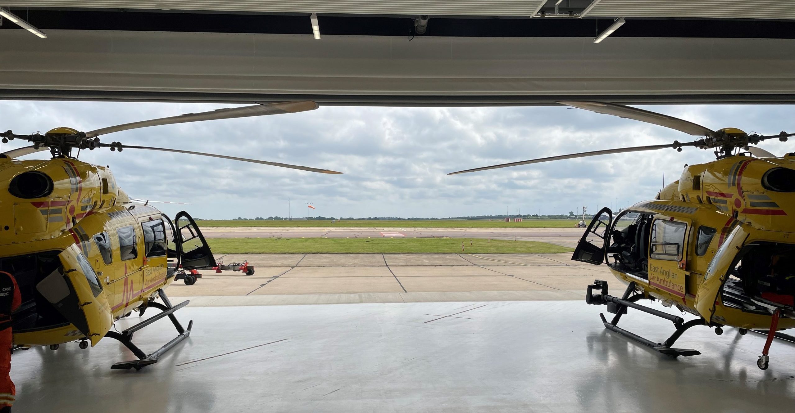 two helicopters at Norwich operating base inside hangar