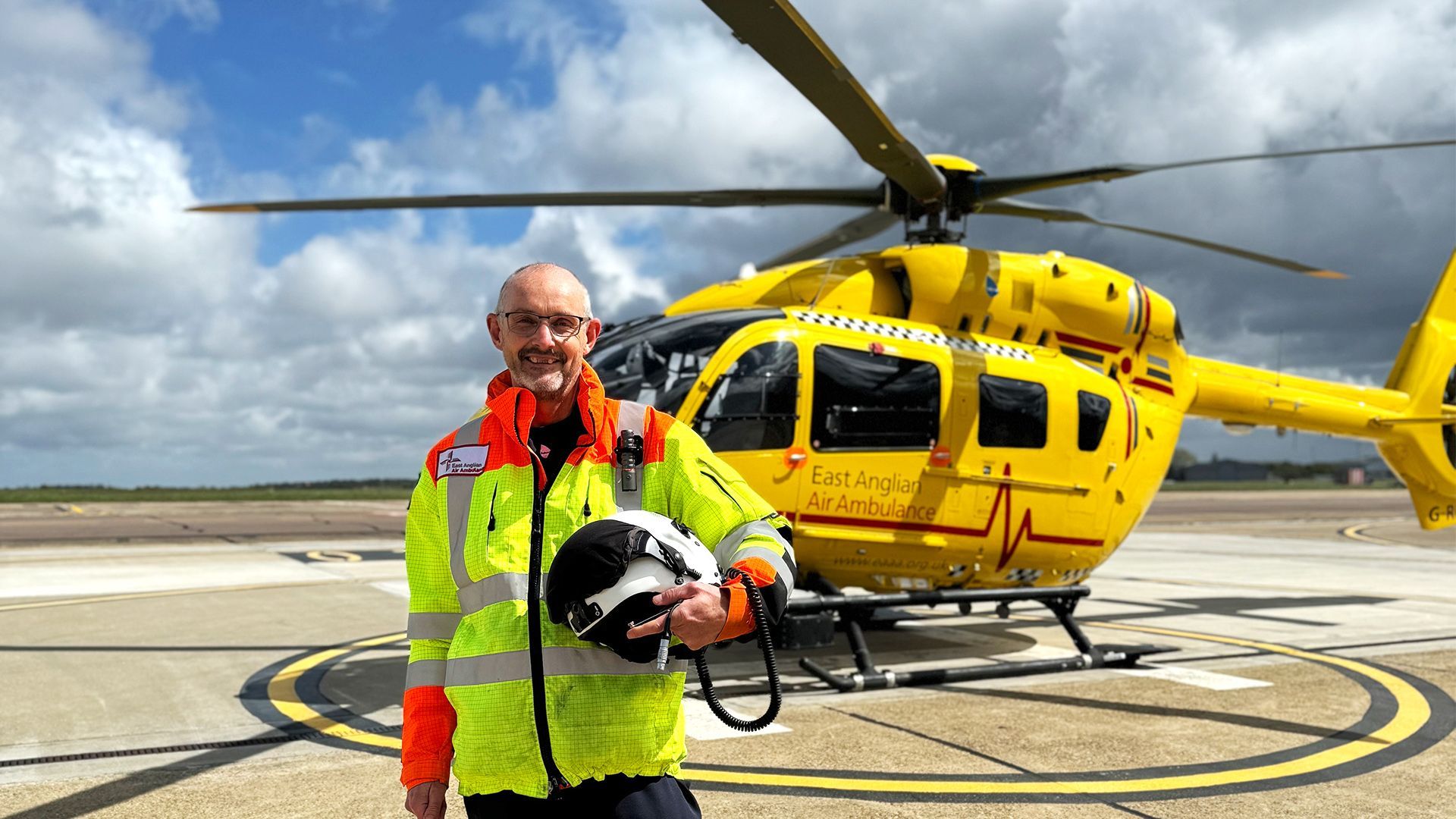 Pilot Steve Norris stood in front of EAAA helicopter