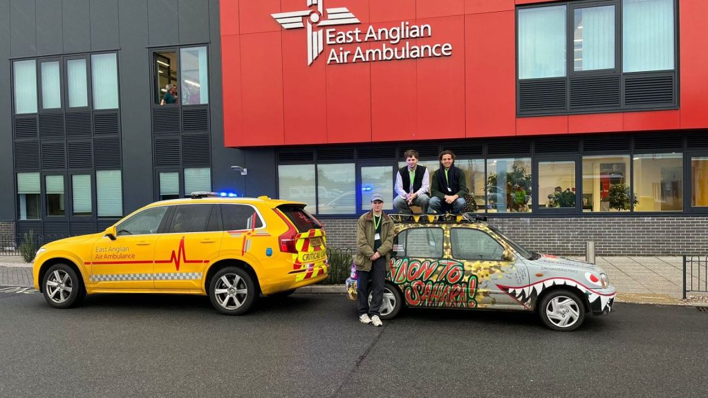 Poles of inconvenience team outside Helimed House