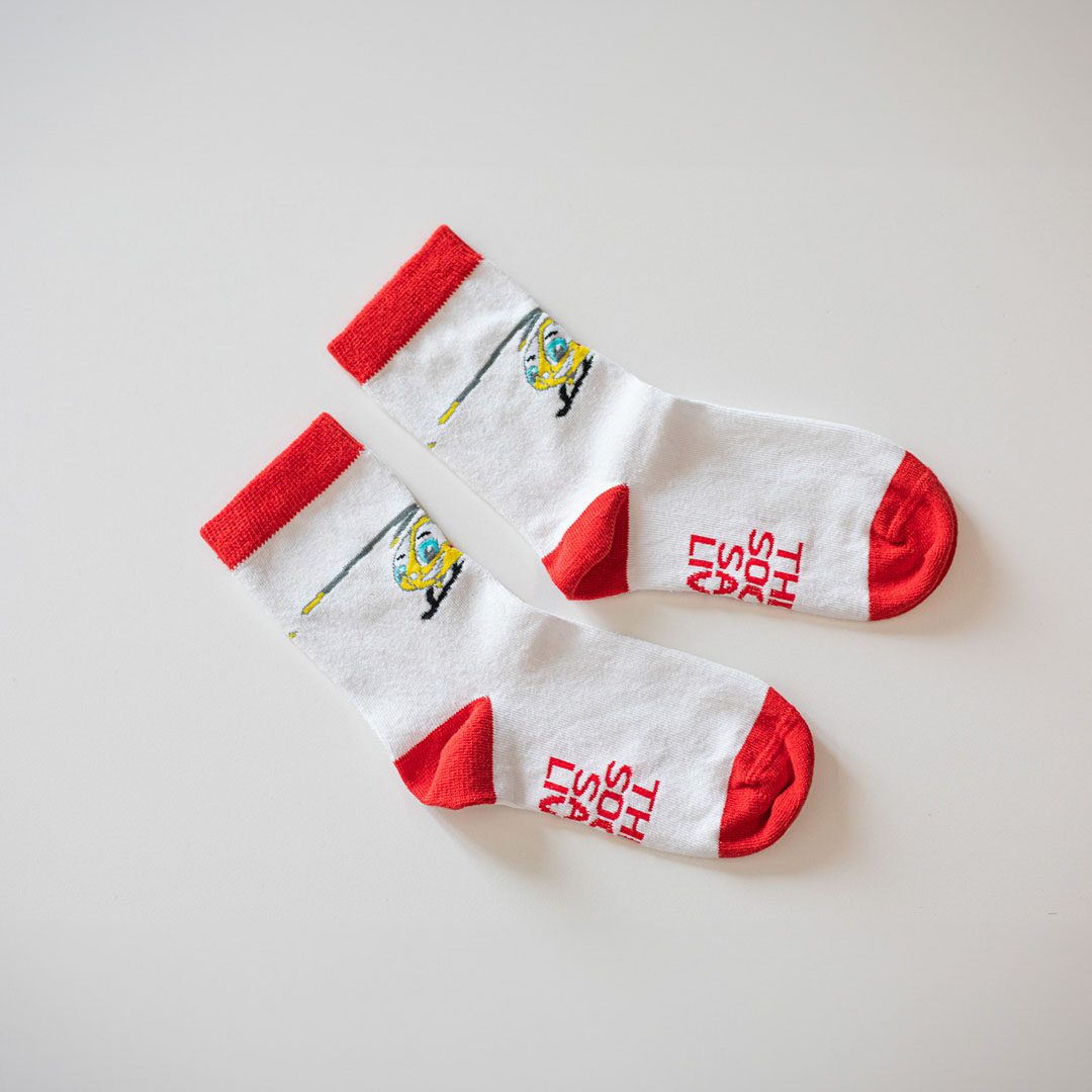 White and red children's sock with EAAA 'Helibobs' mascot laid flat side by side