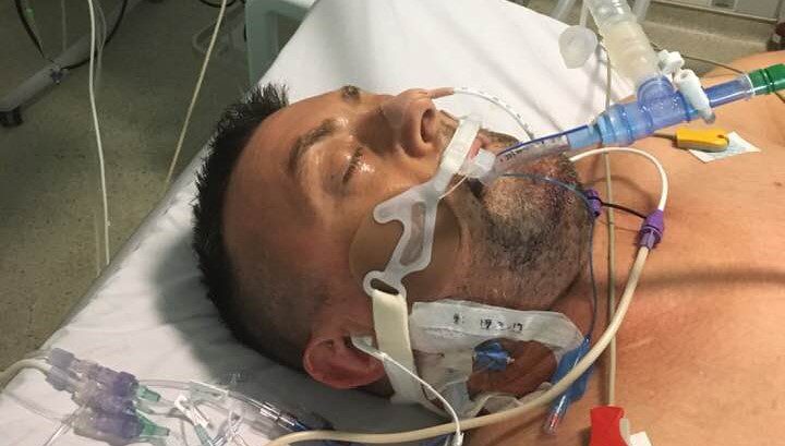 Steve in hospital in an induced coma after his incident. 