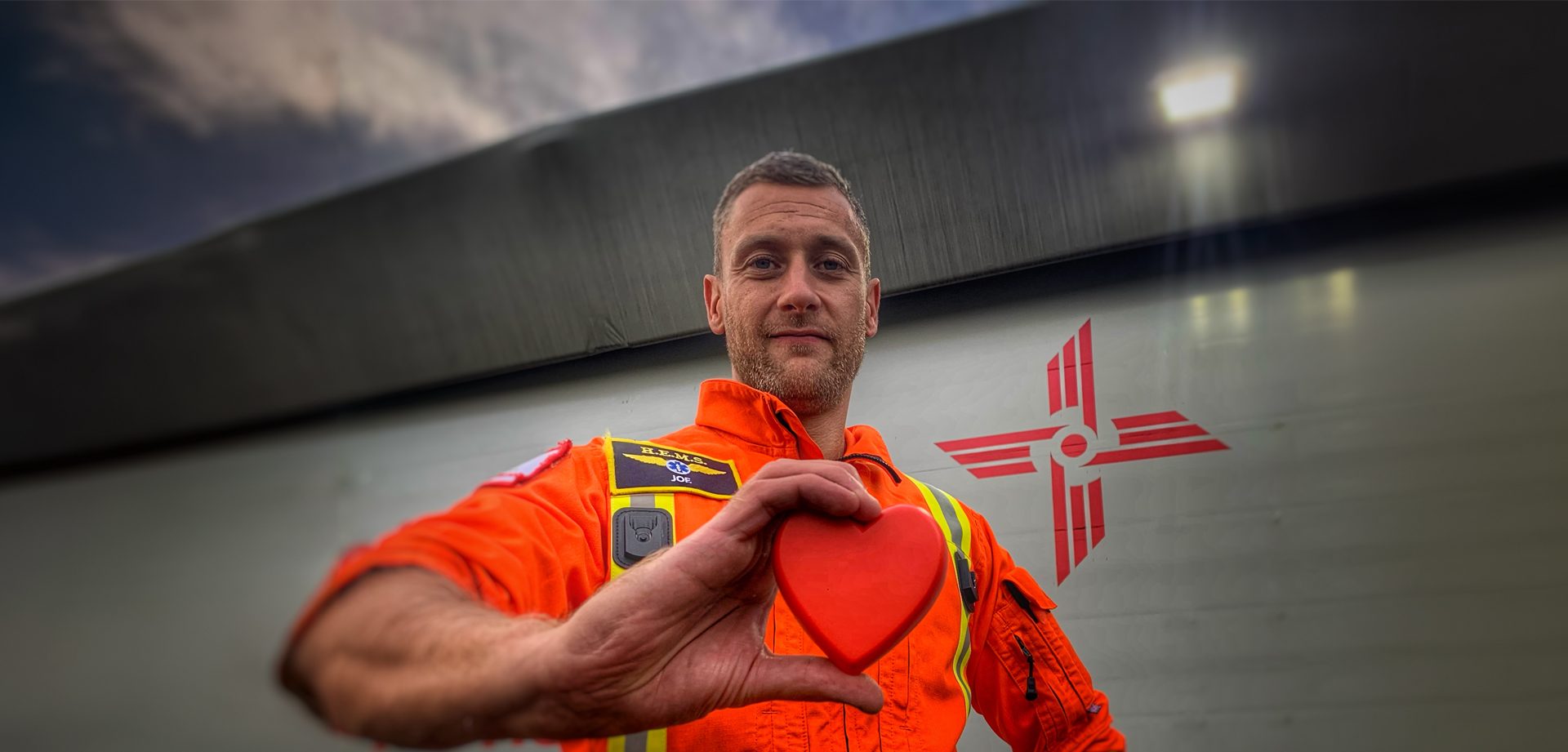 critical care paramedic Joe Dowsing holding a heart