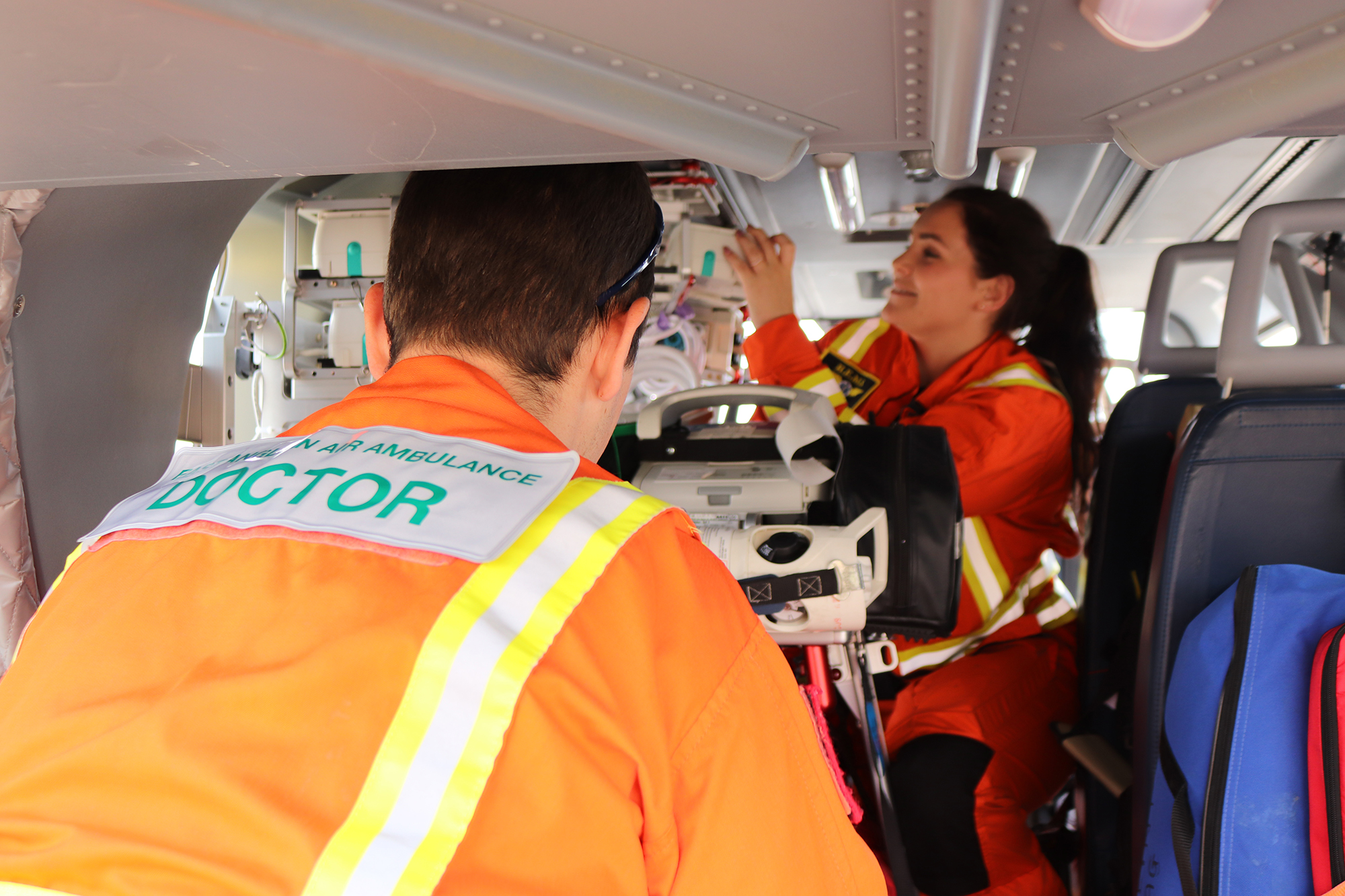 Doctor and paramedic work in helicopter