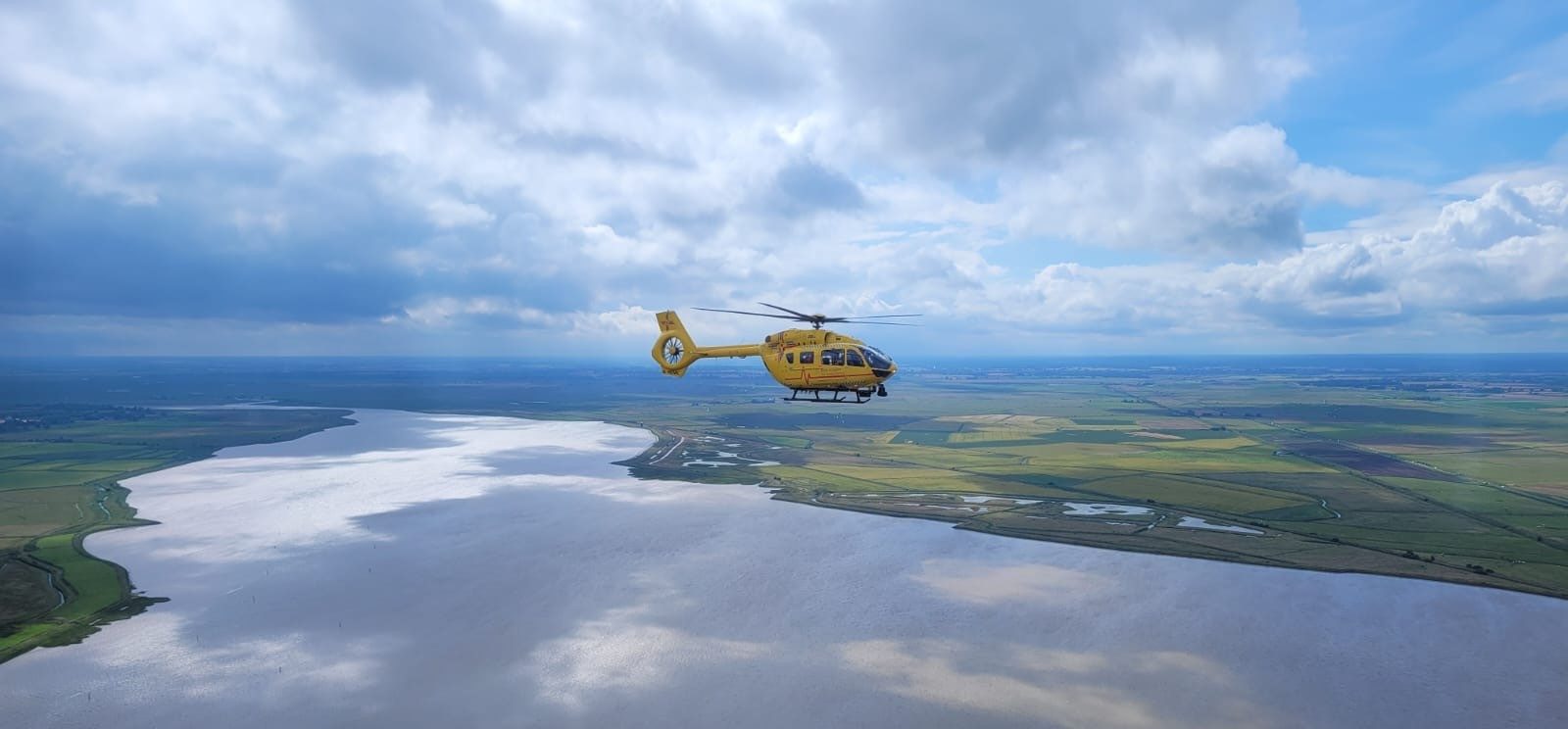 helicopter flying over norfolk countryside