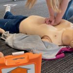 Person delivers chest compressions