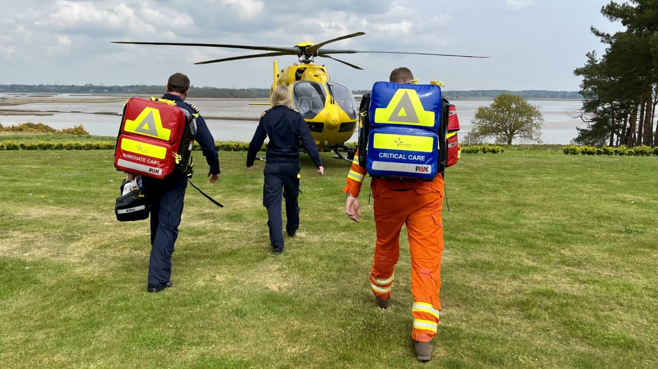 Crew walking to helicopter at scene