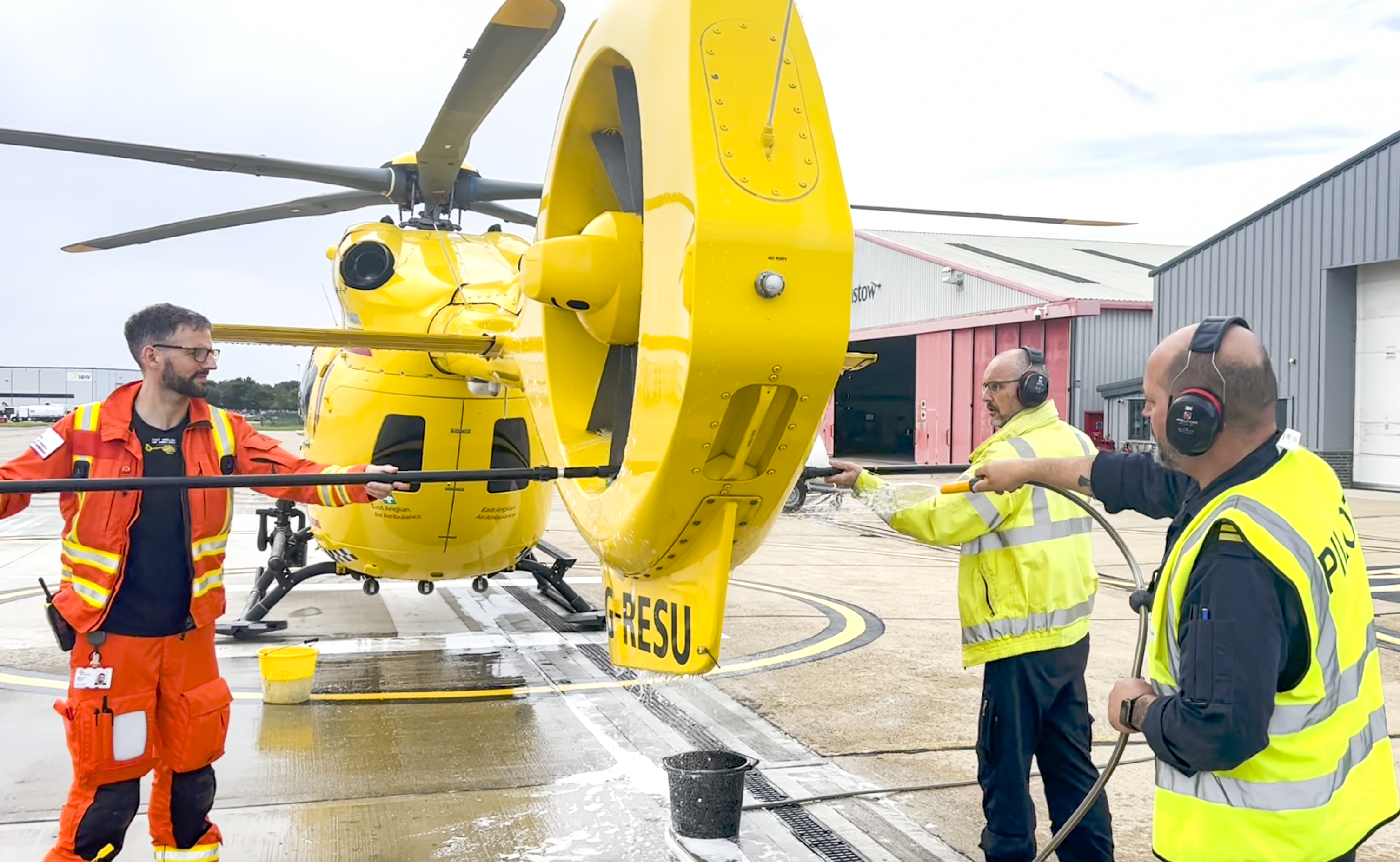 Crew washing helicopter for Trade Up Challenge