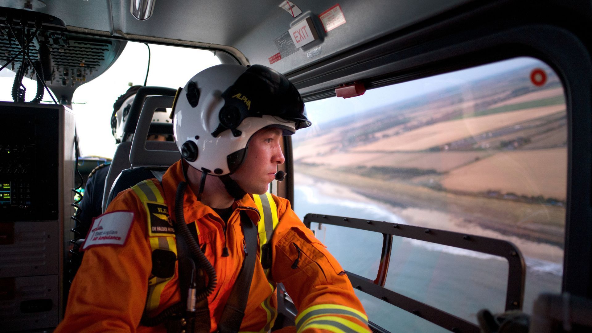 Dr Hutch looking out of helicopter