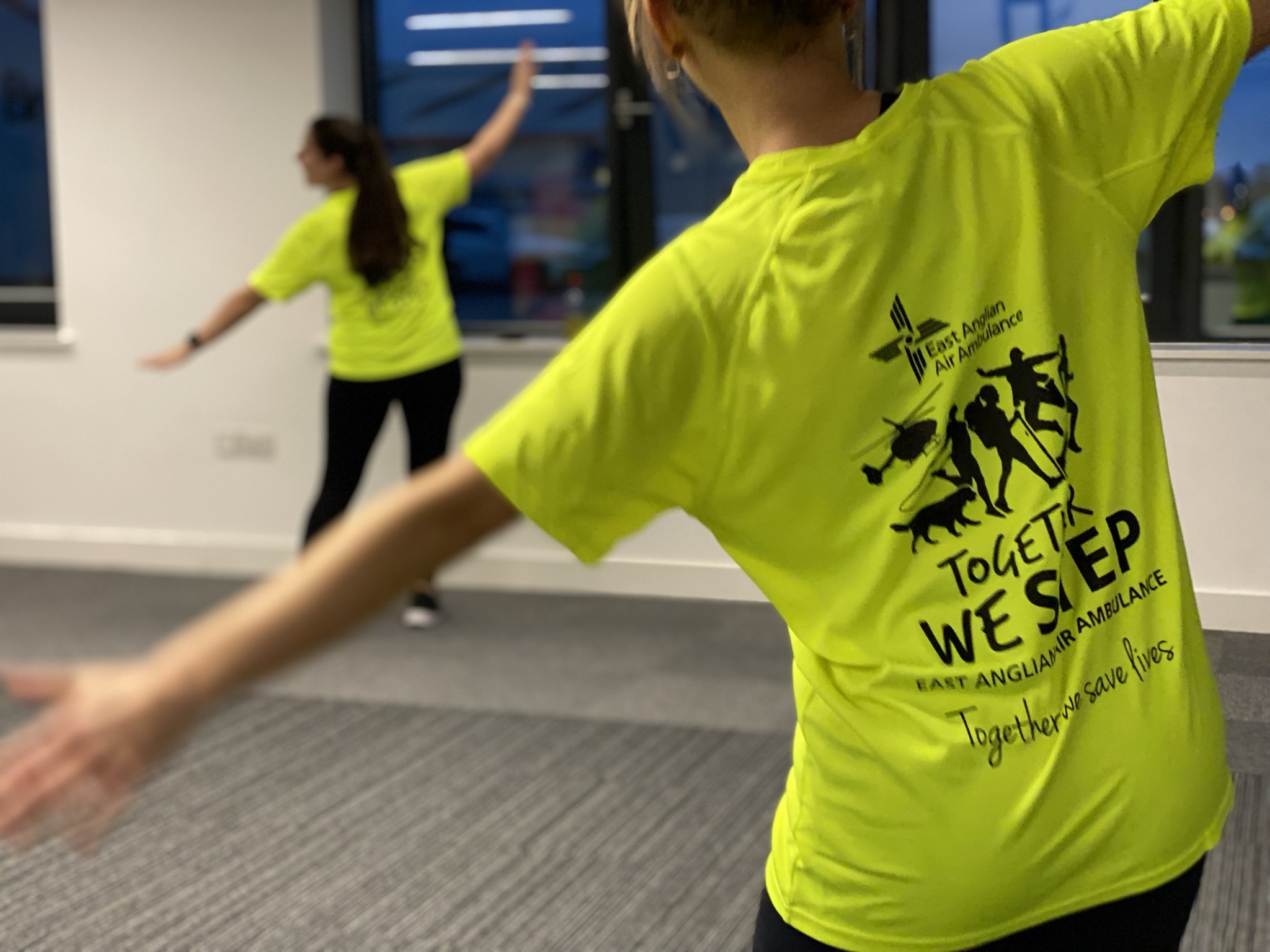 Dancer from behind wearing Together we Step tshirt