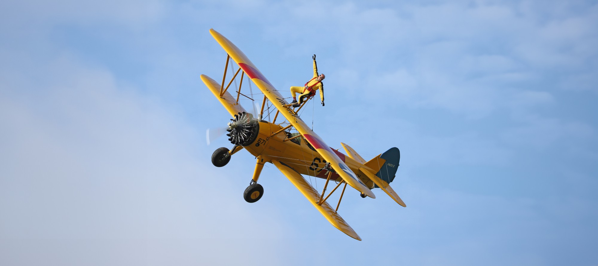 Wingwalking plane in the sky