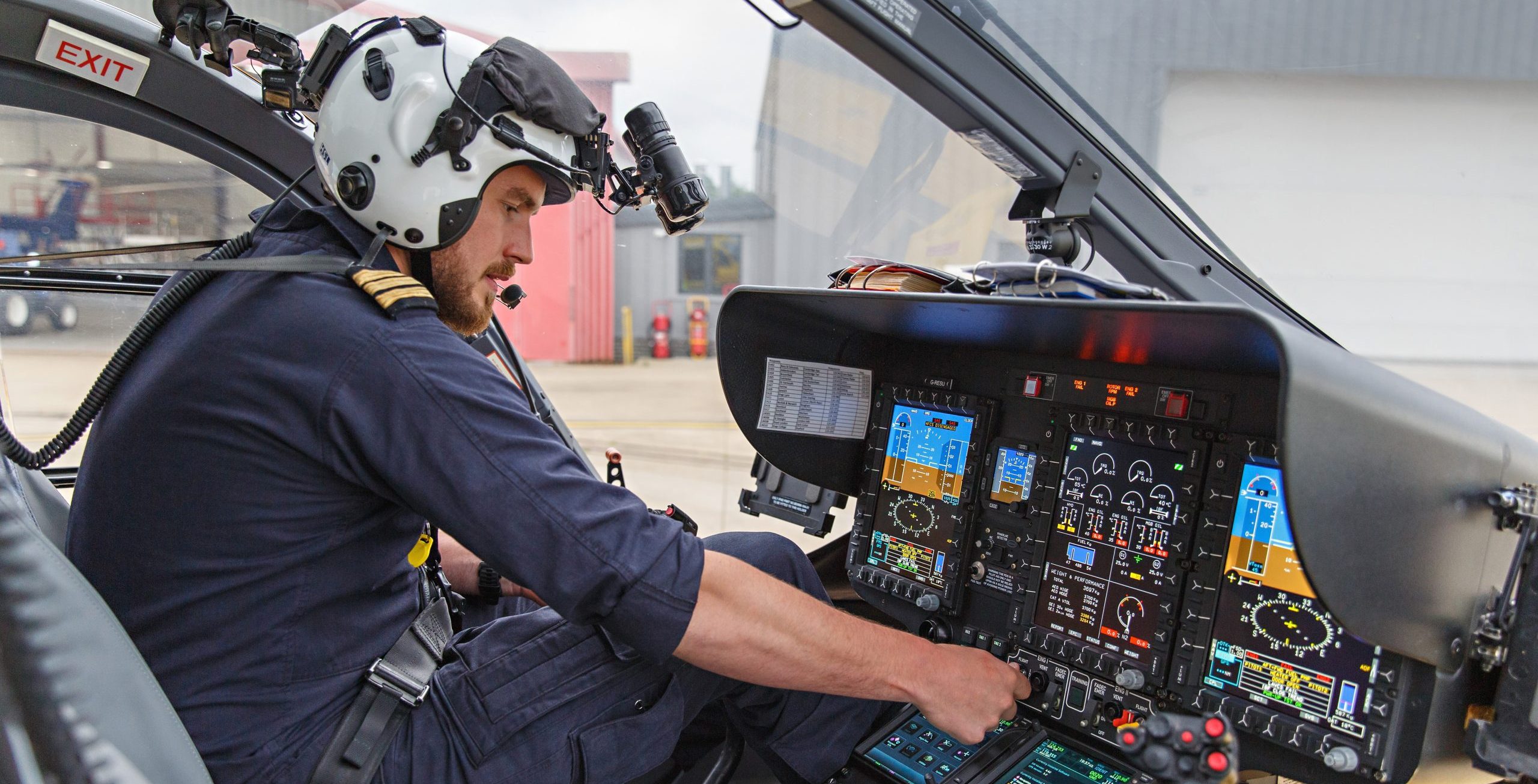 pilot in helicopter starting engine