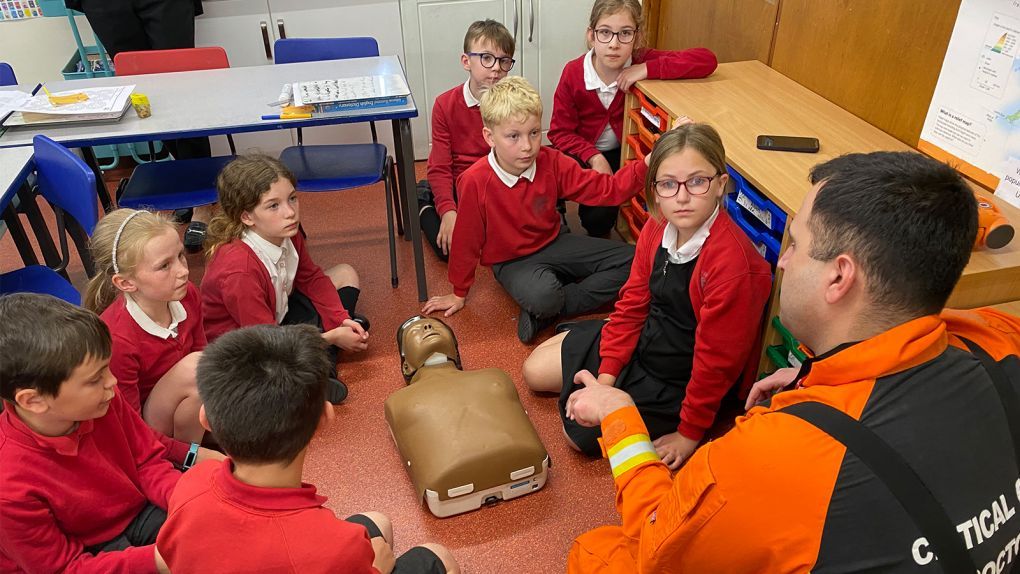 Children learning CPR