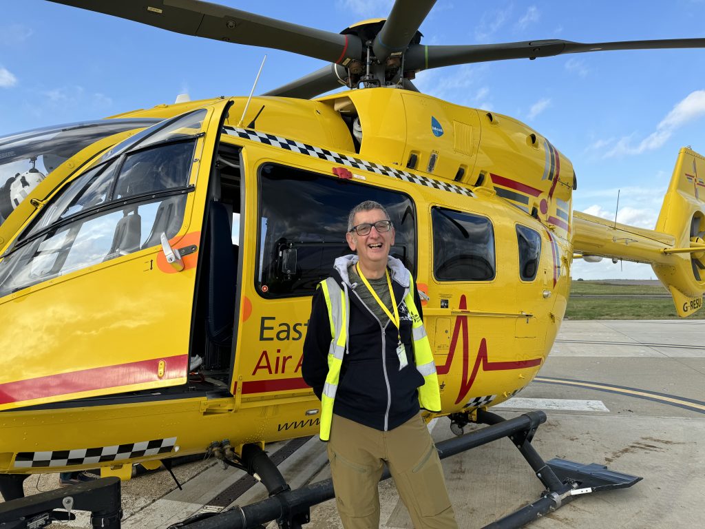 Kevin Marshall in front of the EAAA helicopter