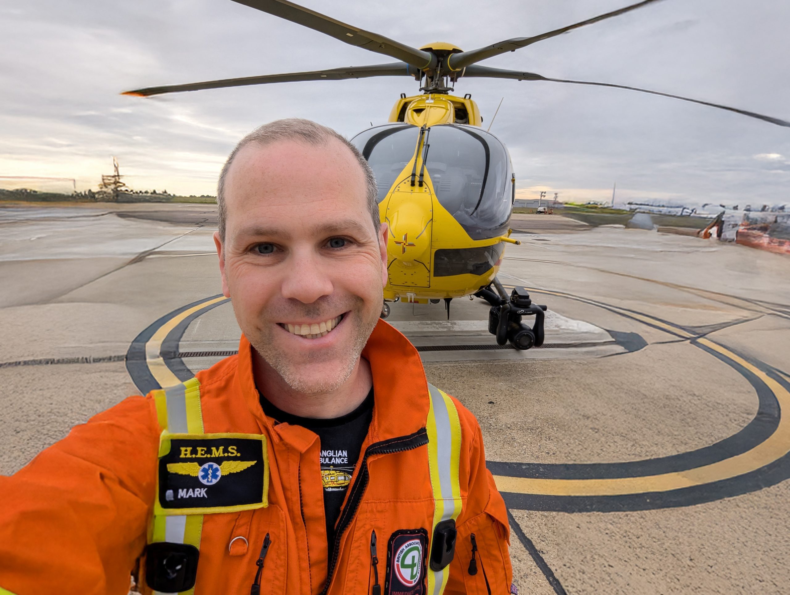 Dr Mark in front of helicopter